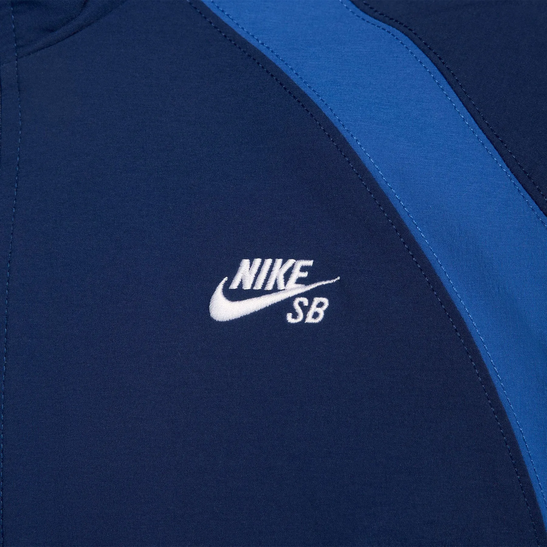 Nike SB Full Zip Woven Skate Jacket: Blue Void/Game Royal-White